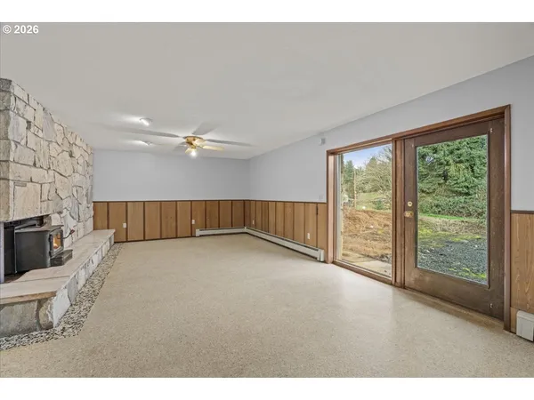 a view of a livingroom with furniture and chandelier fan