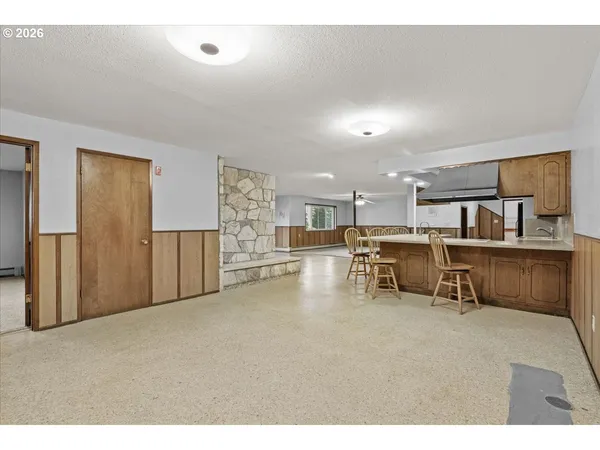 a living room with furniture and a table