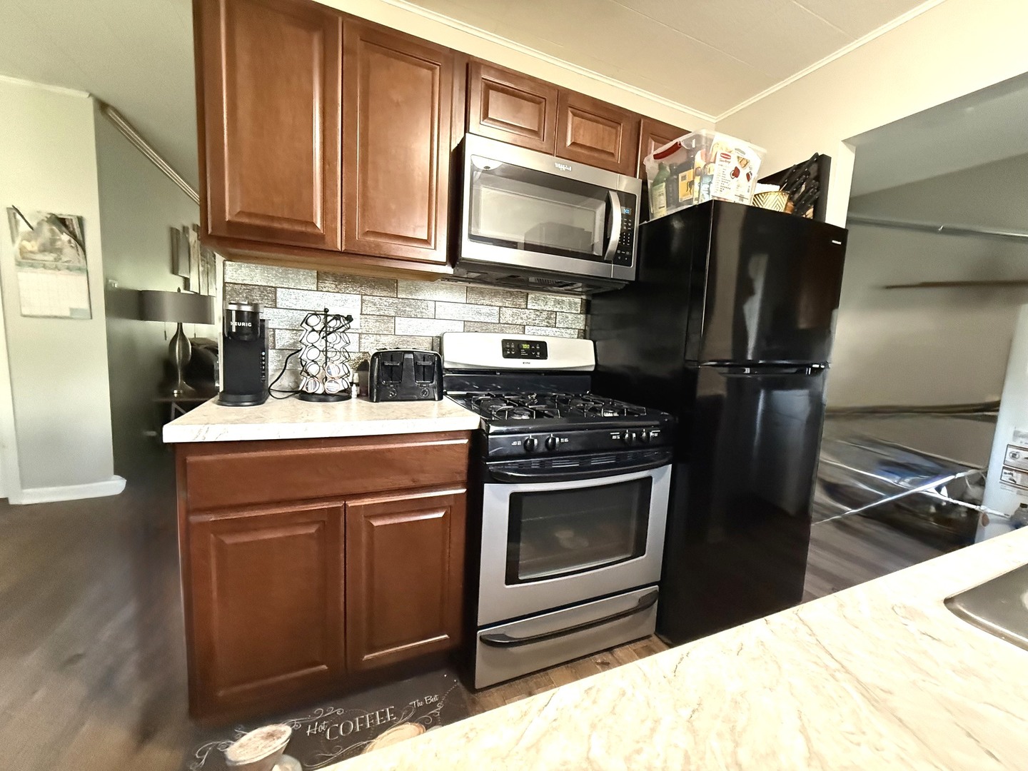 5199 Elmwood Road Oak Forest, IL 60452 - Photo 10 of 30 a kitchen with stainless steel appliances a stove a microwave and a refrigerator