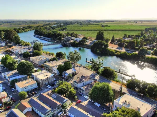 an aerial view of a houses with outdoor space