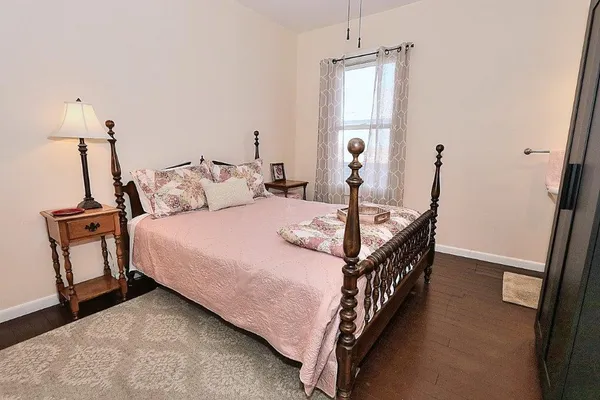 a bed room with a bed and a window