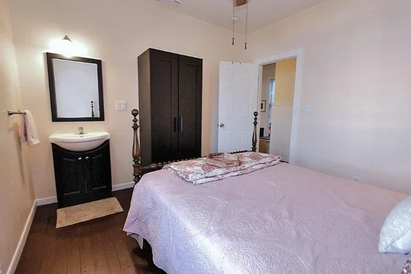 a bedroom with a bed and a bathroom