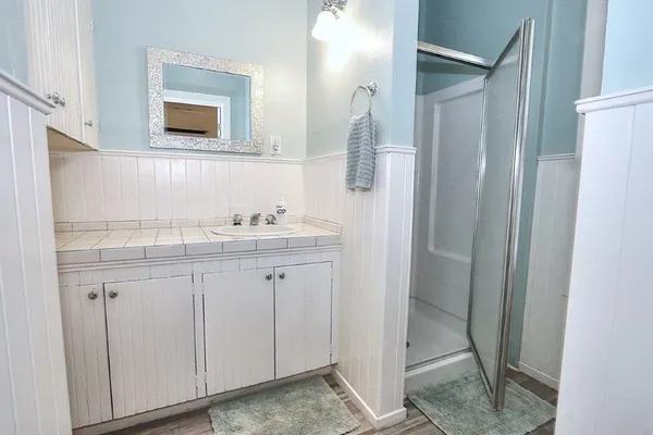 a bathroom with a sink and a mirror