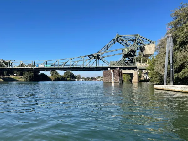 a view of a lake with houses in the background