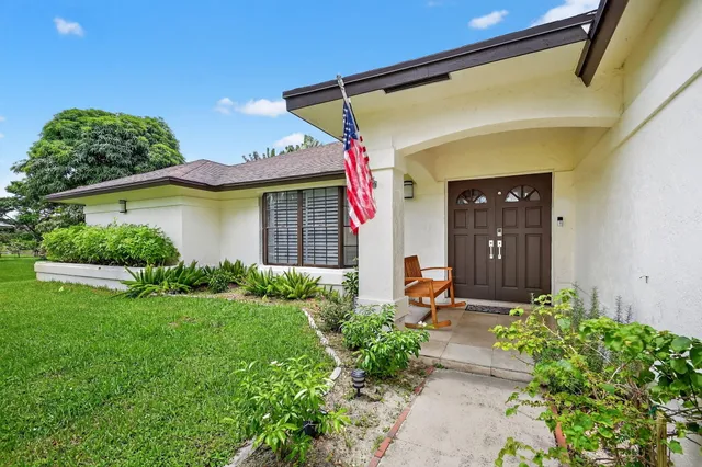 a view of a living room kitchen and a wooden floor