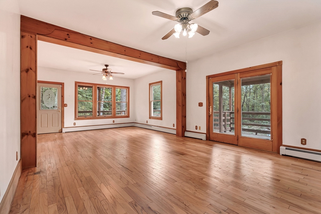 49 R Elm Street Blackstone, MA 01504 - Photo 12 of 42 a view of an empty room with wooden floor and a window