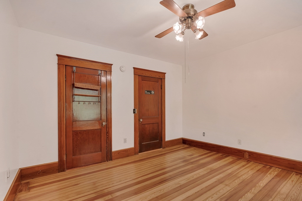 49 R Elm Street Blackstone, MA 01504 - Photo 18 of 42 an empty room with closet and a chandelier fan