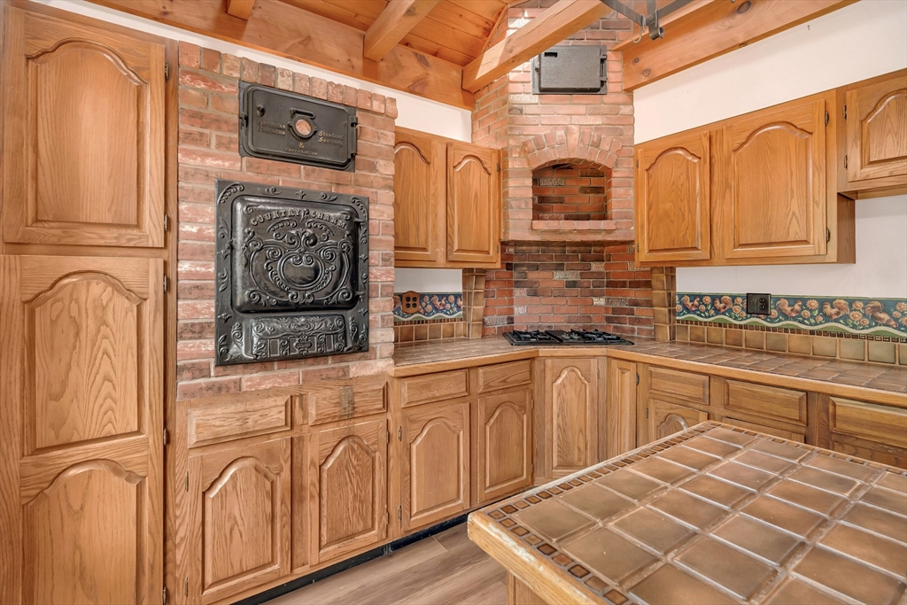49 R Elm Street Blackstone, MA 01504 - Photo 19 of 42 a kitchen with stainless steel appliances granite countertop a stove and cabinets