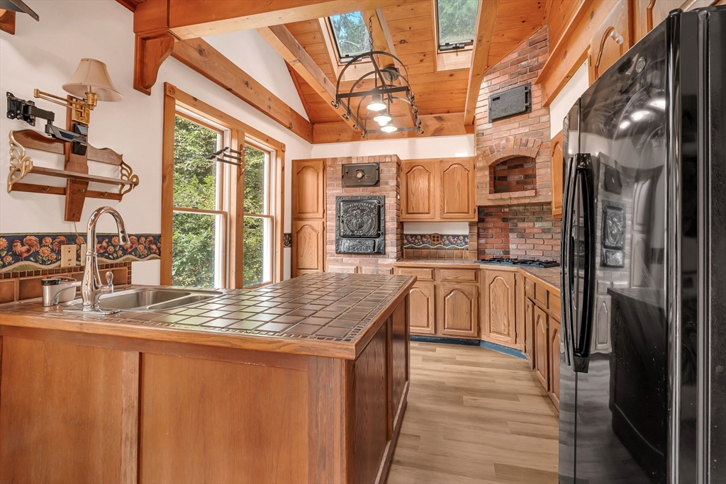 49 R Elm Street Blackstone, MA 01504 - Photo 22 of 42 a kitchen with stainless steel appliances granite countertop a refrigerator a oven and white cabinets