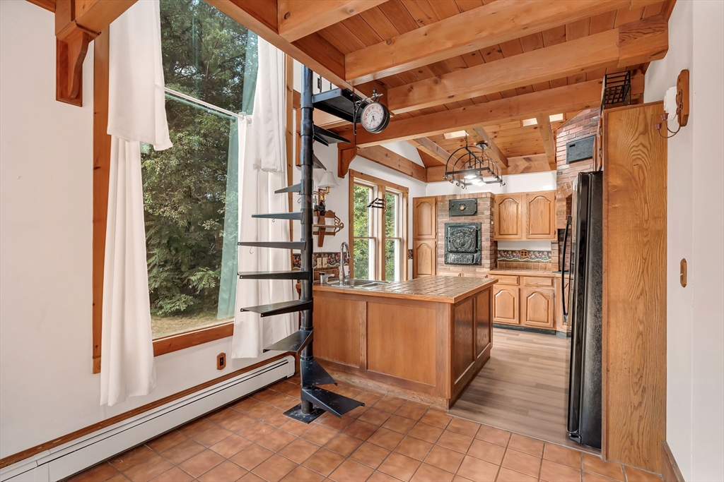 49 R Elm Street Blackstone, MA 01504 - Photo 23 of 42 a view of a large room with wooden floor and windows