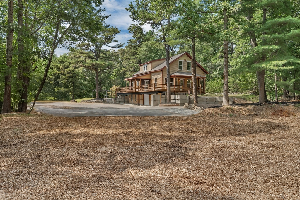 49 R Elm Street Blackstone, MA 01504 - Photo 3 of 42 a house with trees in the background