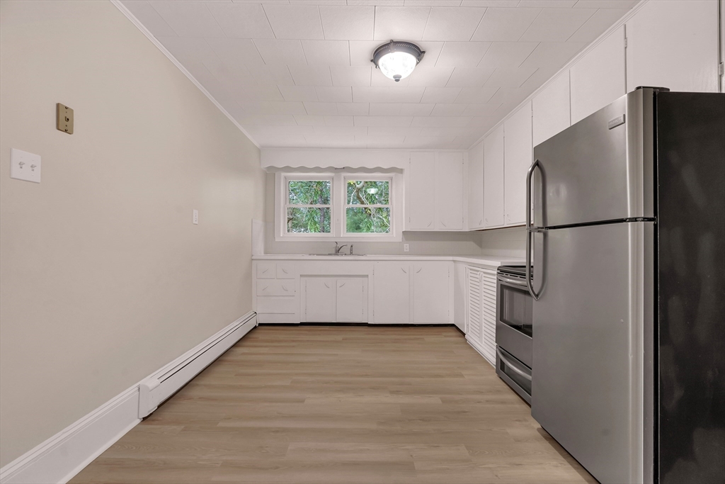 49 R Elm Street Blackstone, MA 01504 - Photo 31 of 42 a kitchen with a refrigerator a sink and dishwasher
