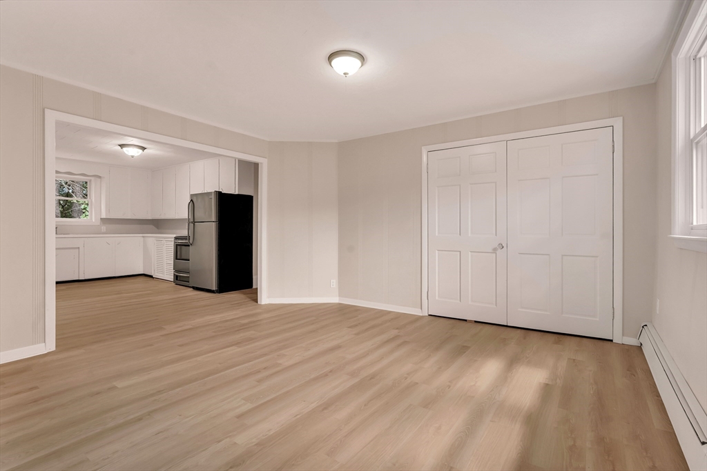 49 R Elm Street Blackstone, MA 01504 - Photo 32 of 42 a view of empty room with wooden floor