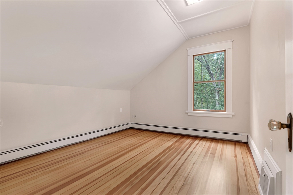 49 R Elm Street Blackstone, MA 01504 - Photo 34 of 42 an empty room with wooden floor and windows