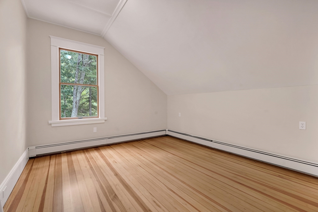 49 R Elm Street Blackstone, MA 01504 - Photo 36 of 42 a view of an empty room with wooden floor and a window