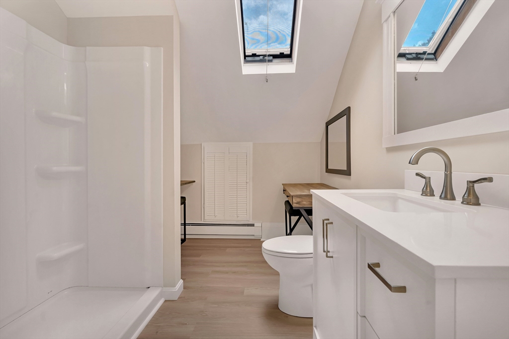 49 R Elm Street Blackstone, MA 01504 - Photo 38 of 42 a bathroom with a sink and mirror