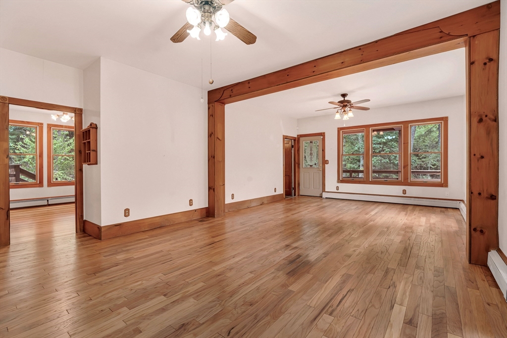 49 R Elm Street Blackstone, MA 01504 - Photo 10 of 42 a view of an empty room with wooden floor and a window
