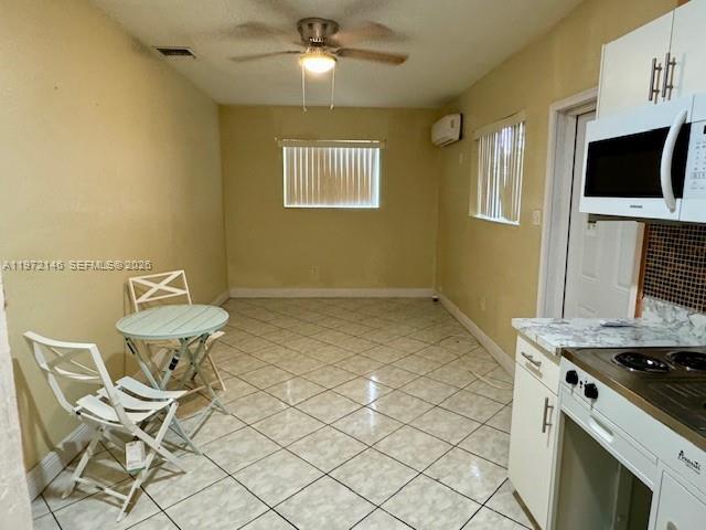 6471 Southwest 27th Street, Unit 2 Miramar, FL 33023 - Photo 1 of 41 a kitchen with stainless steel appliances granite countertop a sink and a stove