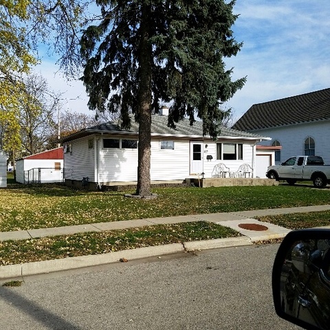 623 South 3rd Street Rochelle, IL 61068 - Photo 1 of 12 a front view of a house with a yard and garage