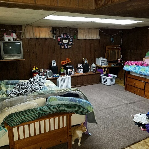 623 South 3rd Street Rochelle, IL 61068 - Photo 12 of 12 a bedroom with furniture and a lamp