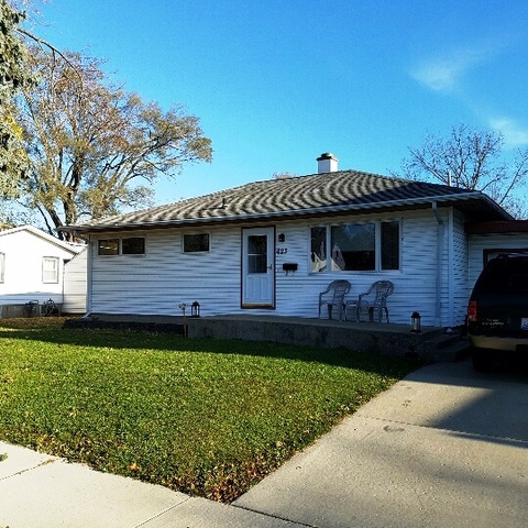 623 South 3rd Street Rochelle, IL 61068 - Photo 5 of 12 a front view of a house with a garden