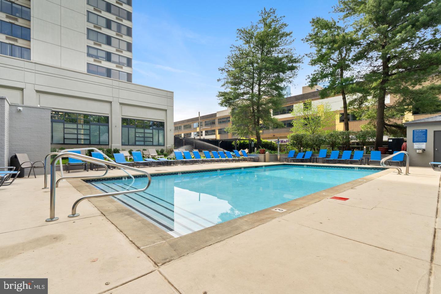 2001 Hamilton Street, Unit 1221 Philadelphia, PA 19130 - Photo 18 of 27 a view of a building with a swimming pool and sitting area