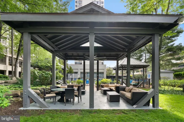 a view of swimming pool with outdoor seating