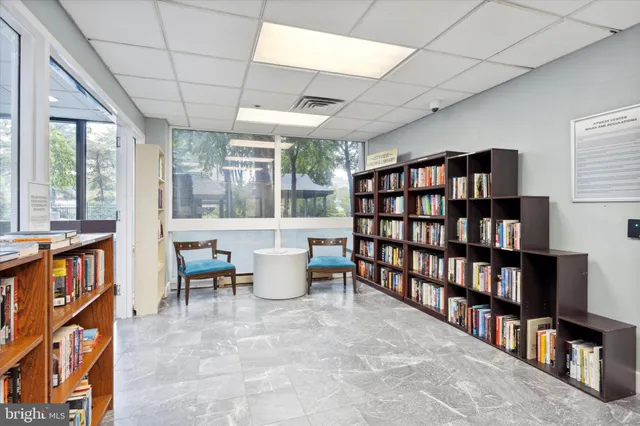 a view of a livingroom with furniture and staircase