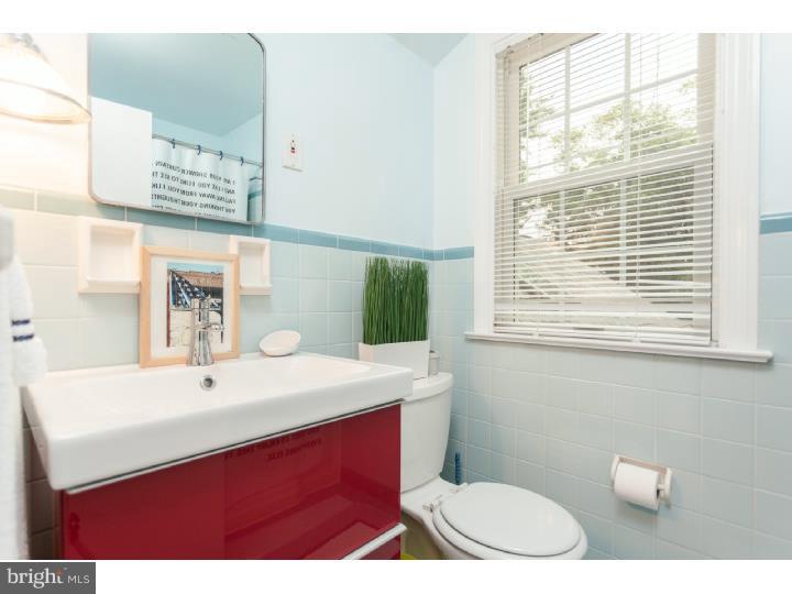 149 Fairview Road Penn Valley, PA 19072 - Photo 18 of 24 a bathroom with a sink a toilet and mirror