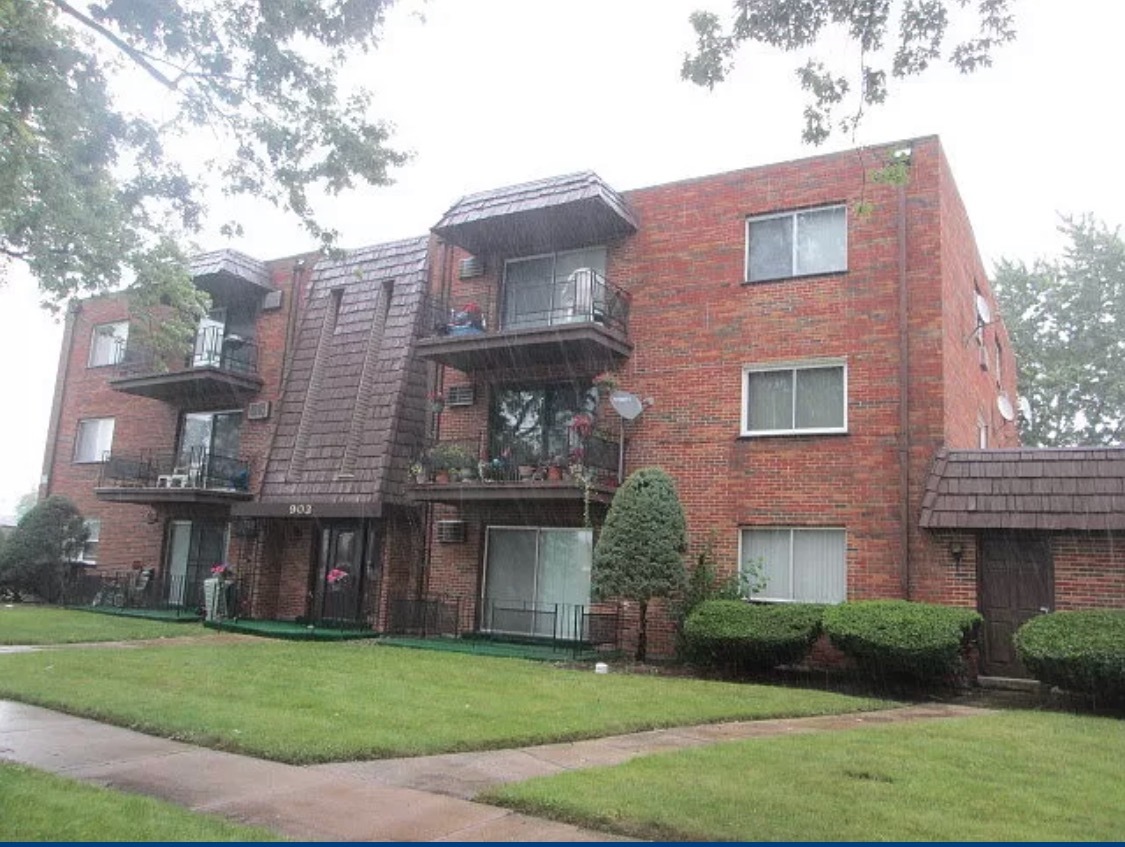 903 Elder Road, Unit 11 Homewood, IL 60430 - Photo 1 of 9 a brick building that has a lots of windows in it