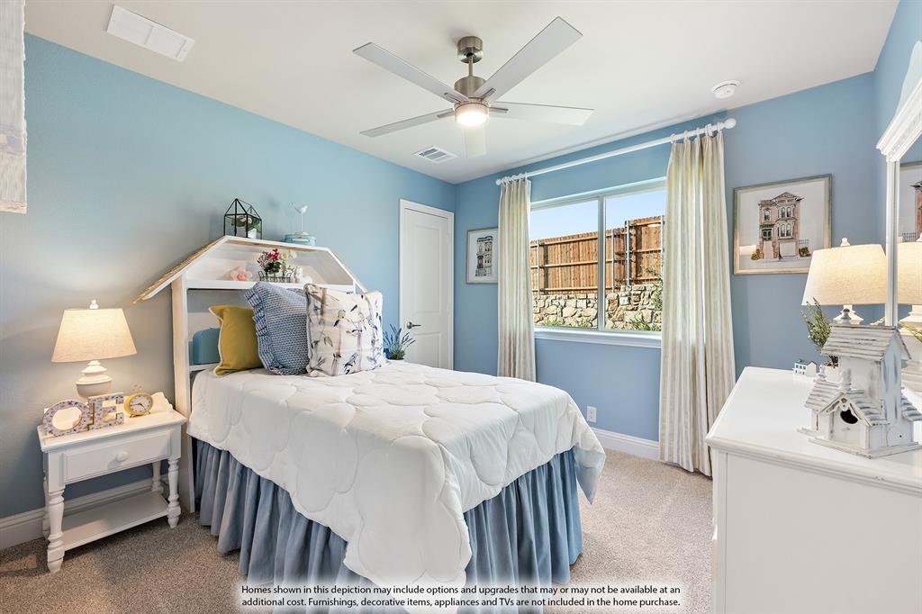 14550 Lovelace Street Pilot Point, TX 76258 - Photo 21 of 23 a bedroom with a bed and a chandelier