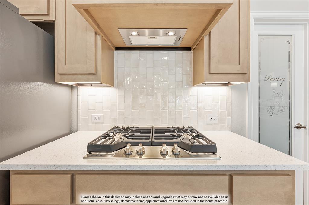 14550 Lovelace Street Pilot Point, TX 76258 - Photo 7 of 23 a white stove top oven sitting inside of a kitchen