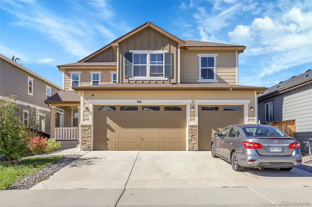 a view of a car park in front of house