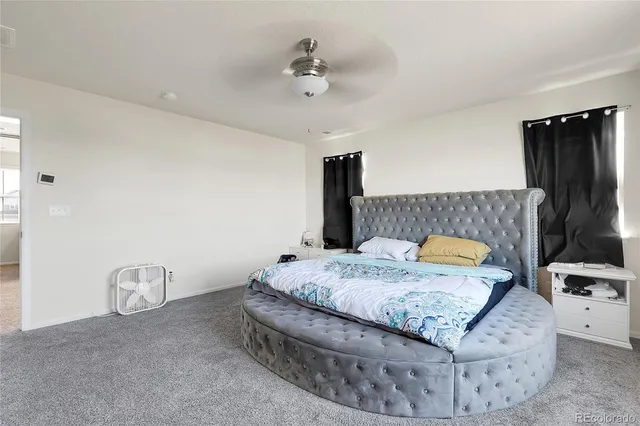 a bedroom with bed and window