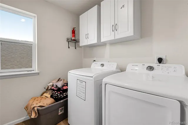 a utility room with dryer and washer