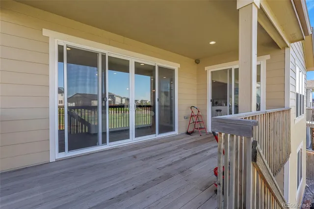 a view of a house with wooden floor and floor to ceiling window