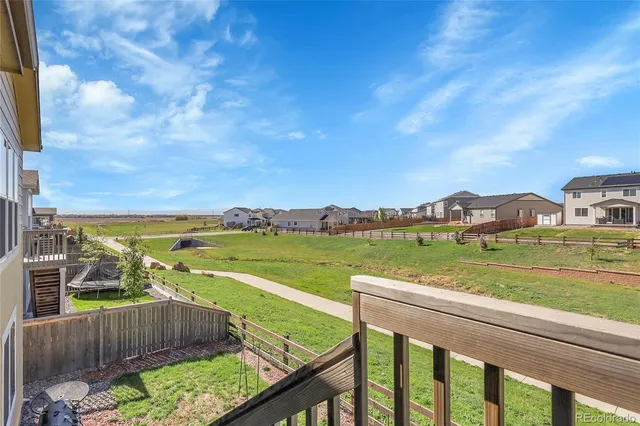 a dining room with furniture water view and wooden floor