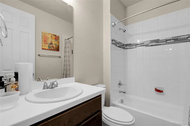 a bathroom with a sink toilet and a bathtub