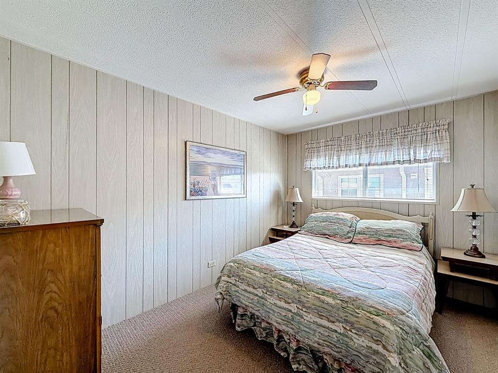 1100 South Belcher Road, Unit 561 Largo, FL 33771 - Photo 13 of 23 a bedroom with a bed and a window