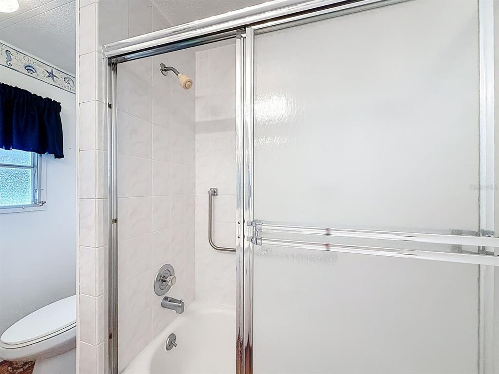 1100 South Belcher Road, Unit 561 Largo, FL 33771 - Photo 16 of 23 a bathroom with a shower and a toilet