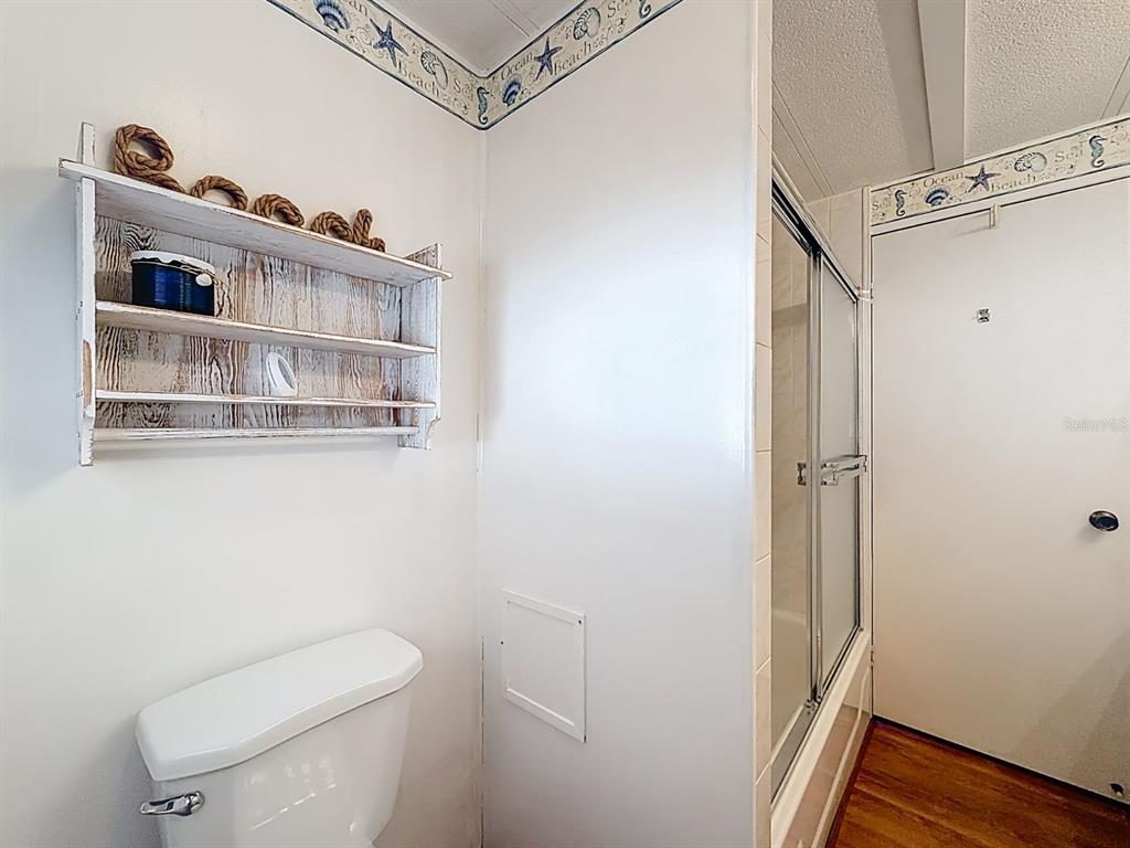 1100 South Belcher Road, Unit 561 Largo, FL 33771 - Photo 20 of 23 a bathroom with a toilet a sink and a window