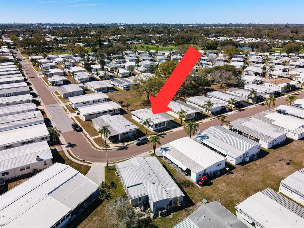 1100 South Belcher Road, Unit 561 Largo, FL 33771 - Photo 2 of 23 an aerial view of a house with a yard