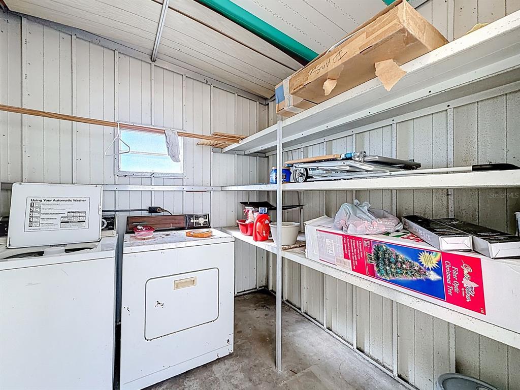 1100 South Belcher Road, Unit 561 Largo, FL 33771 - Photo 22 of 23 a utility room with dryer and washer