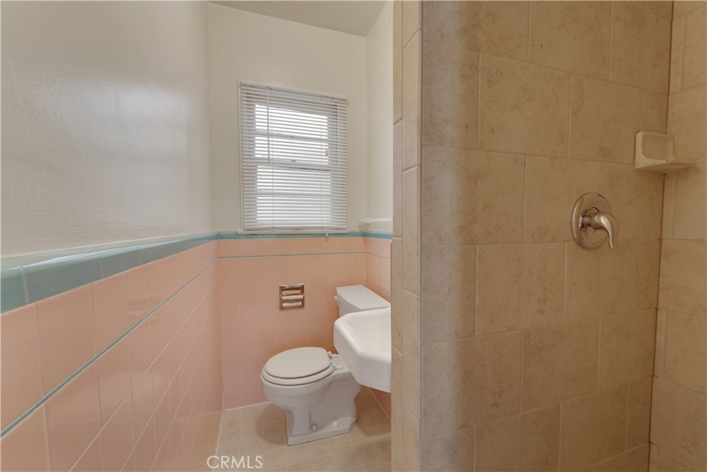 30 North 1st Street, Unit 8 Alhambra, CA 91801 - Photo 4 of 6 a bathroom with a toilet and a shower