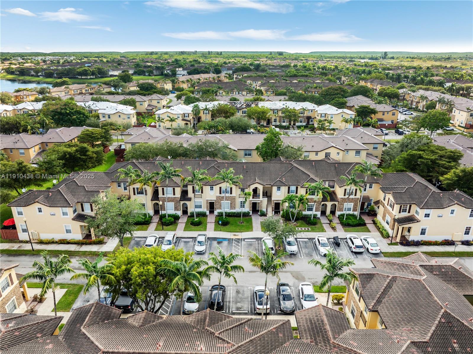9239 Southwest 227th Street, Unit 4 Cutler Bay, FL 33190 - Photo 24 of 29 an aerial view of a city with lots of residential buildings