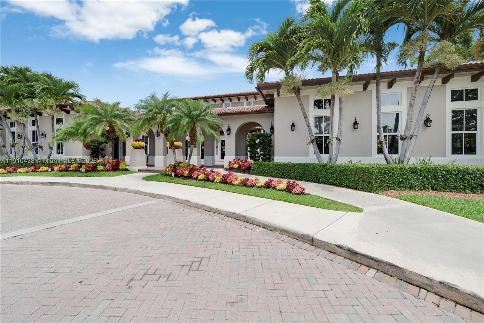 9239 Southwest 227th Street, Unit 4 Cutler Bay, FL 33190 - Photo 5 of 29 a front view of multiple houses with yard