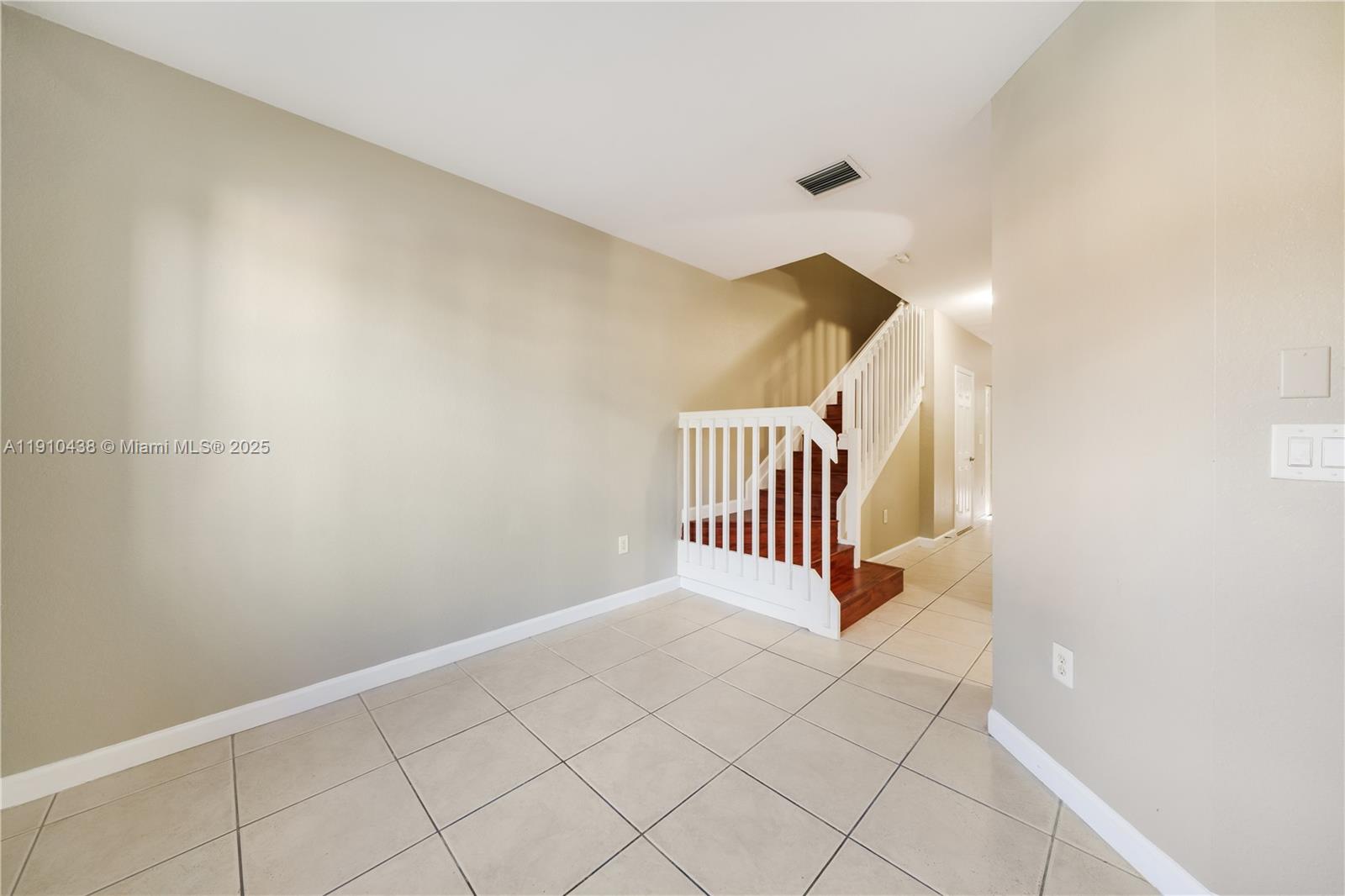 9239 Southwest 227th Street, Unit 4 Cutler Bay, FL 33190 - Photo 7 of 29 a view of entryway with wooden floor