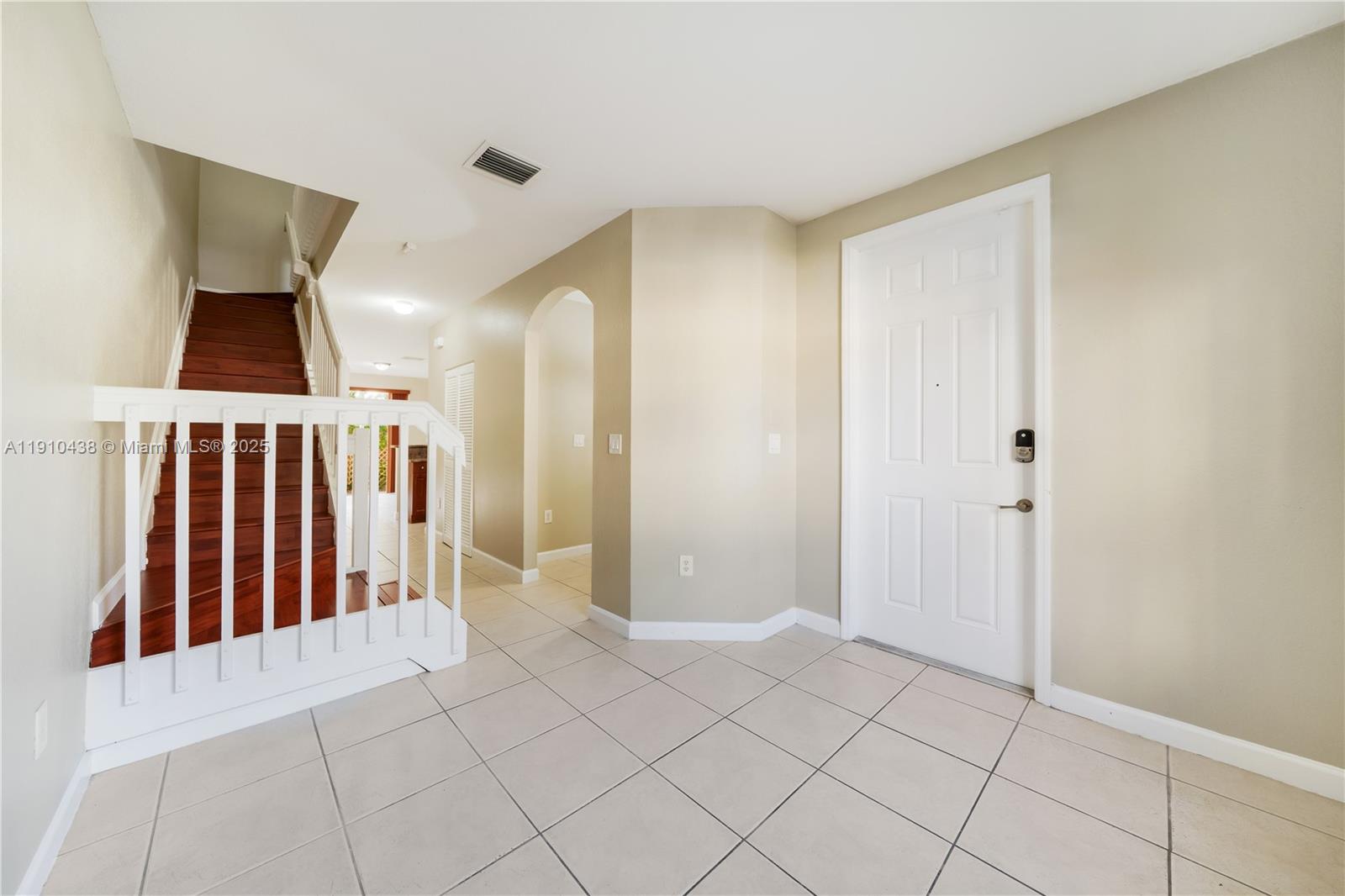 9239 Southwest 227th Street, Unit 4 Cutler Bay, FL 33190 - Photo 8 of 29 a view of entryway with stairs and a fireplace