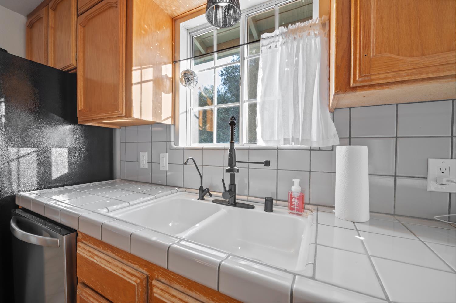 38570 Rustic Lane Squaw Valley, CA 93675 - Photo 11 of 43 a white kitchen with a sink and cabinets