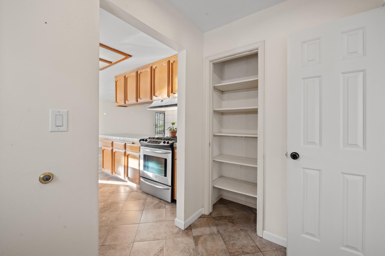 38570 Rustic Lane Squaw Valley, CA 93675 - Photo 12 of 43 a kitchen with a refrigerator and white cabinets